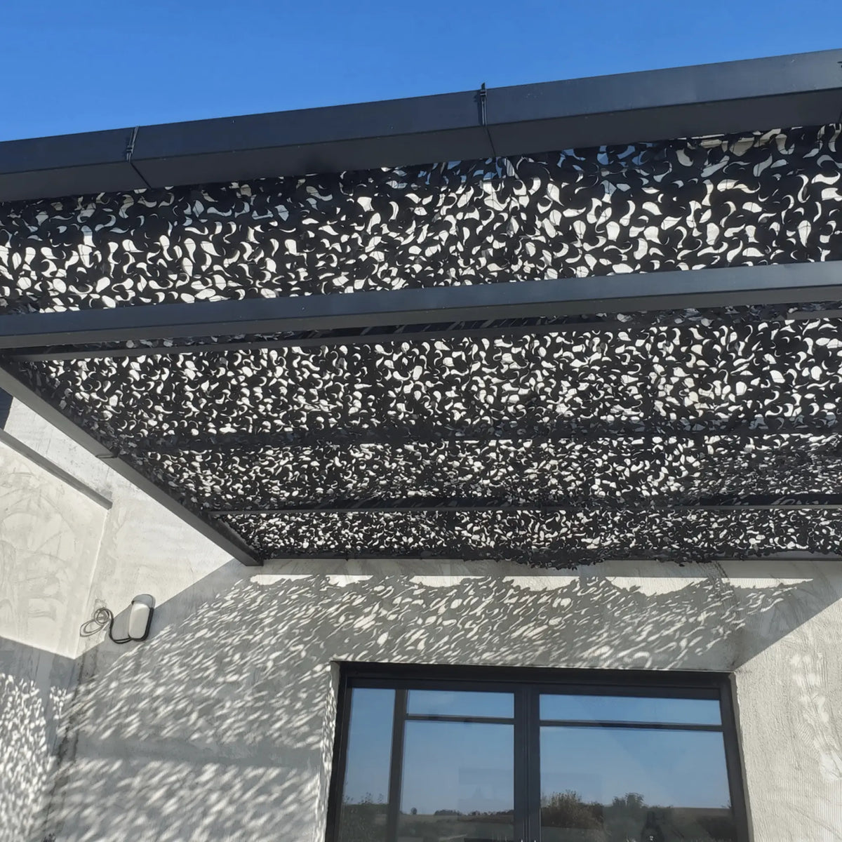 Voile d'ombrage camouflage noir — détail de la matière